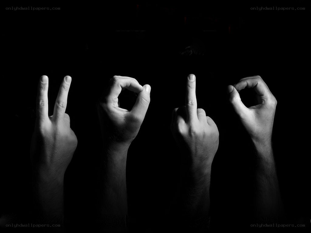 Hands making gestures in dark