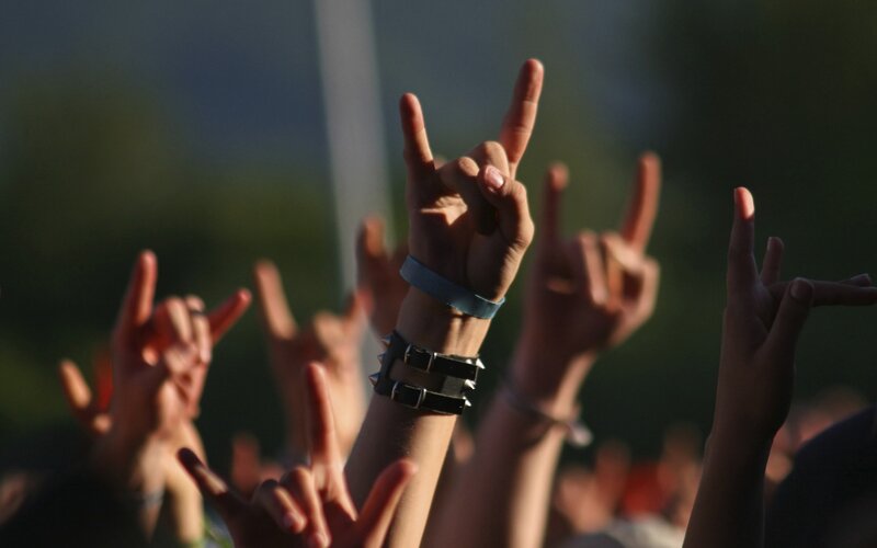 Hands Making Rock Gesture — Brown, Energetic