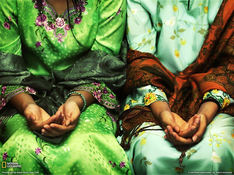 Hands of women in traditional dress