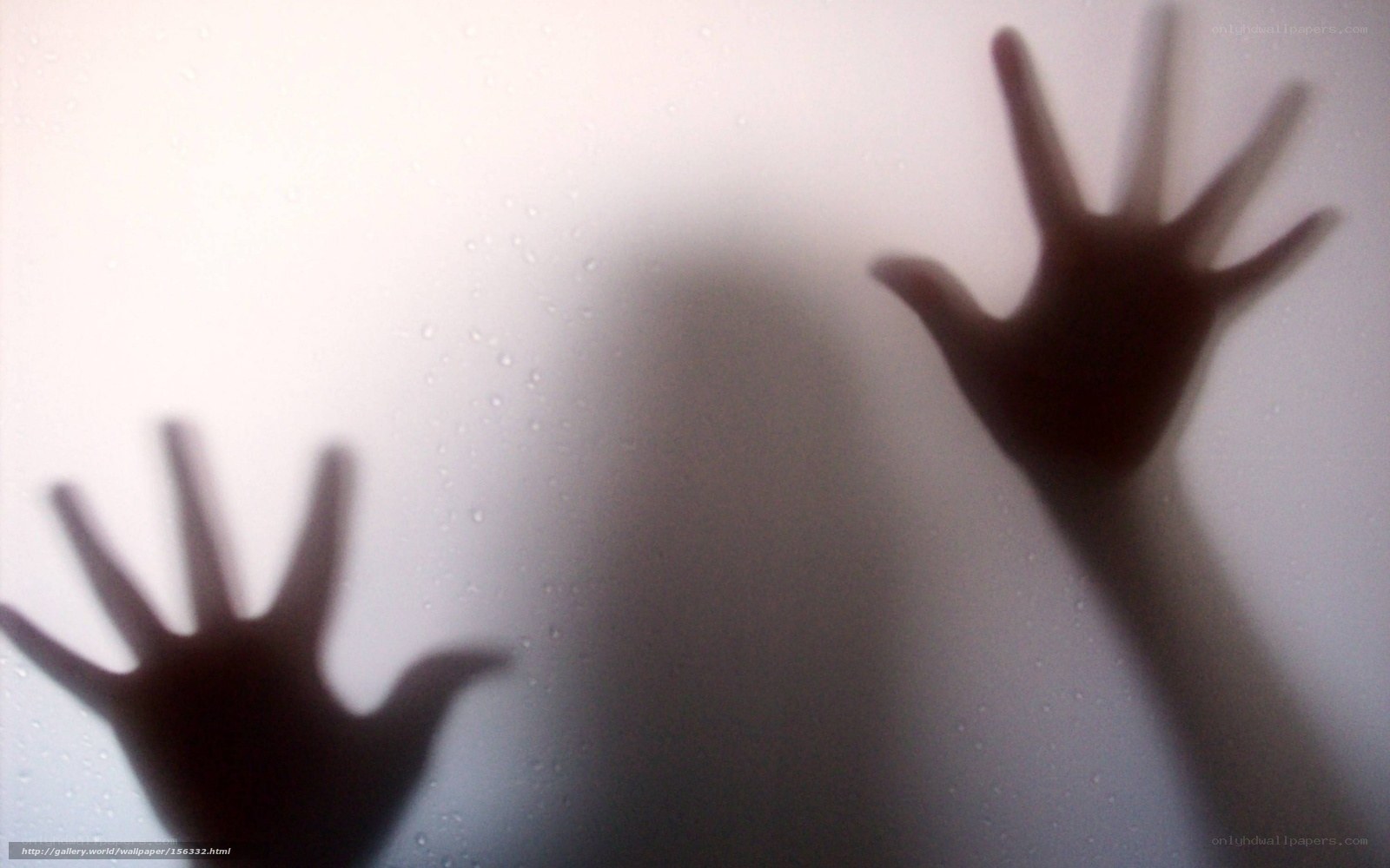 Hands on a fogged glass