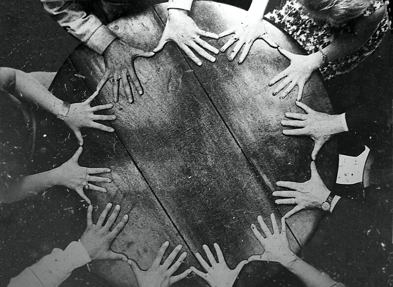 Hands on a wooden table