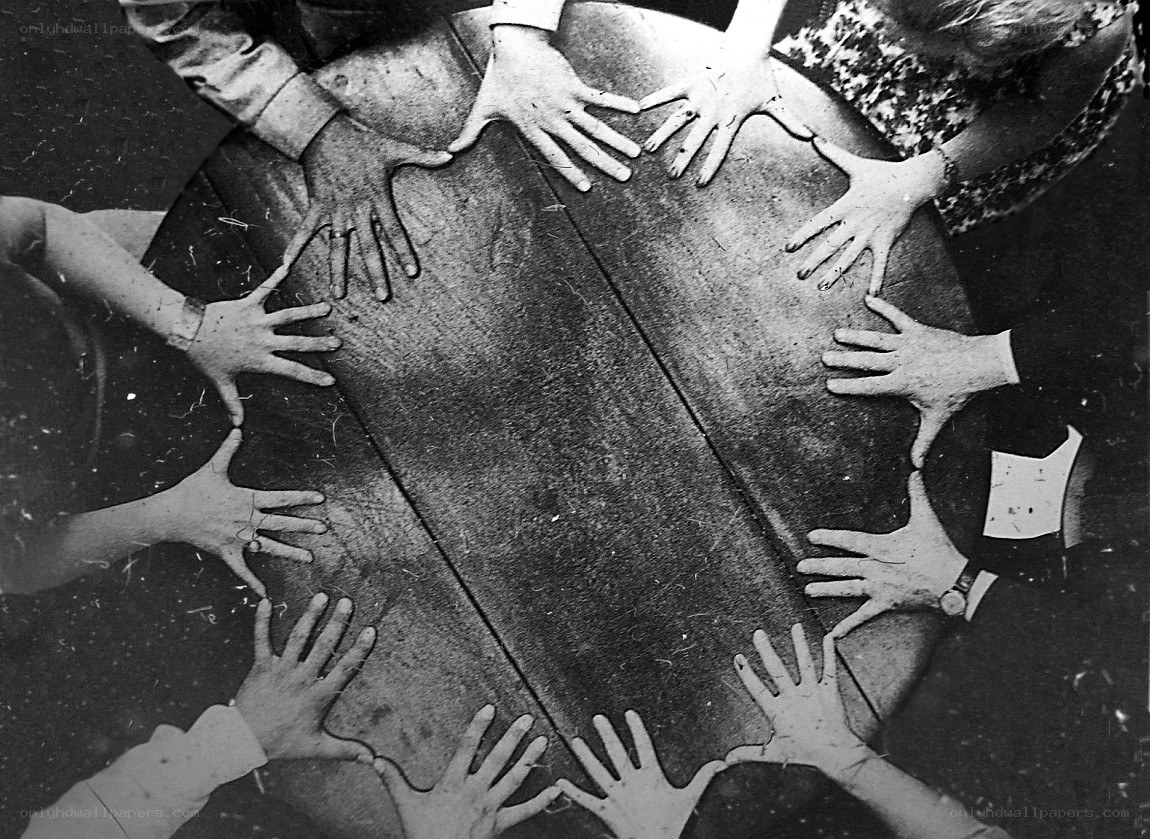 Hands on a wooden table