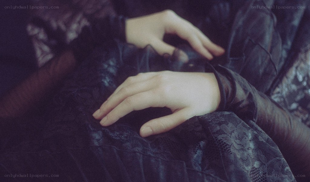 hands on dark fabric