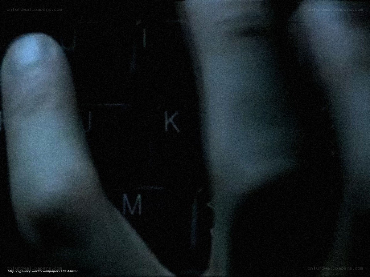 hands on keyboard in dark