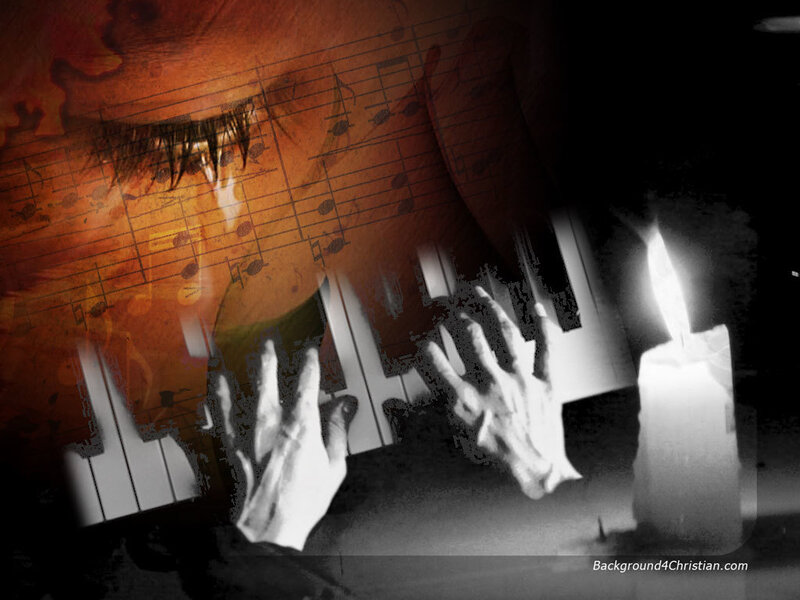 Hands on piano with sheet music