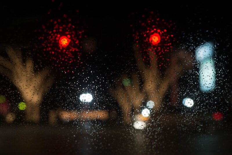 Hands on Wet Window