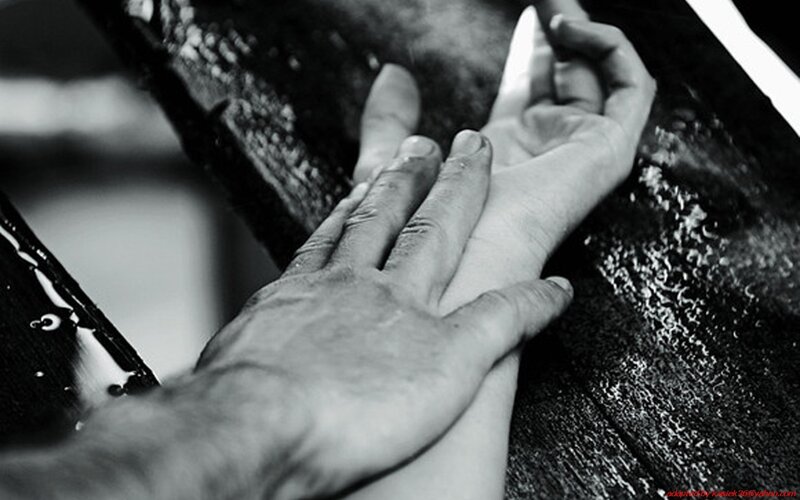 Hands on Wooden Surface