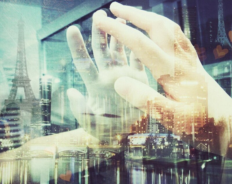 hands over cityscape