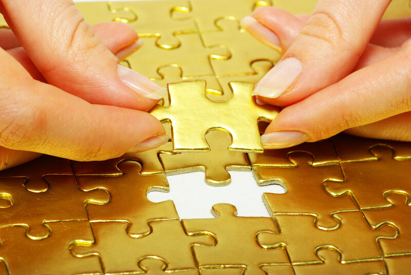 Hands Placing Puzzle Piece