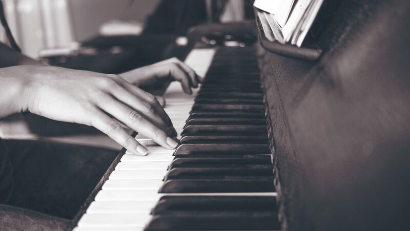 Hands Playing Piano — Black