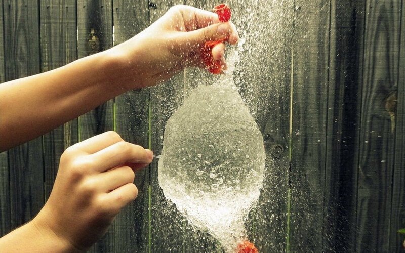 Hands Popping Water Balloon — White, Active