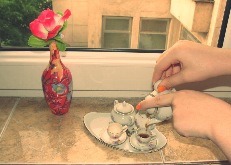 Hands Pouring Tea