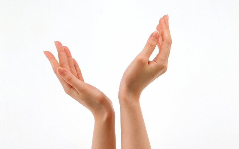 hands raised against white background