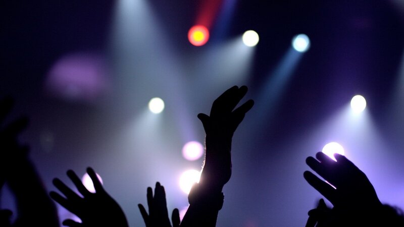 hands raised at concert