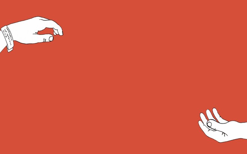 hands reaching across red space
