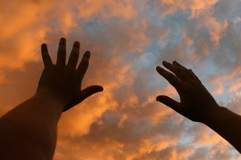 hands reaching for the sky