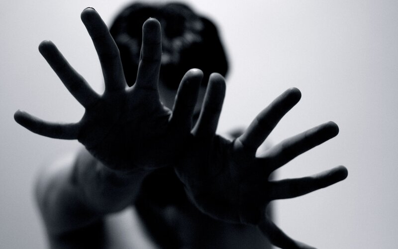 hands reaching forward