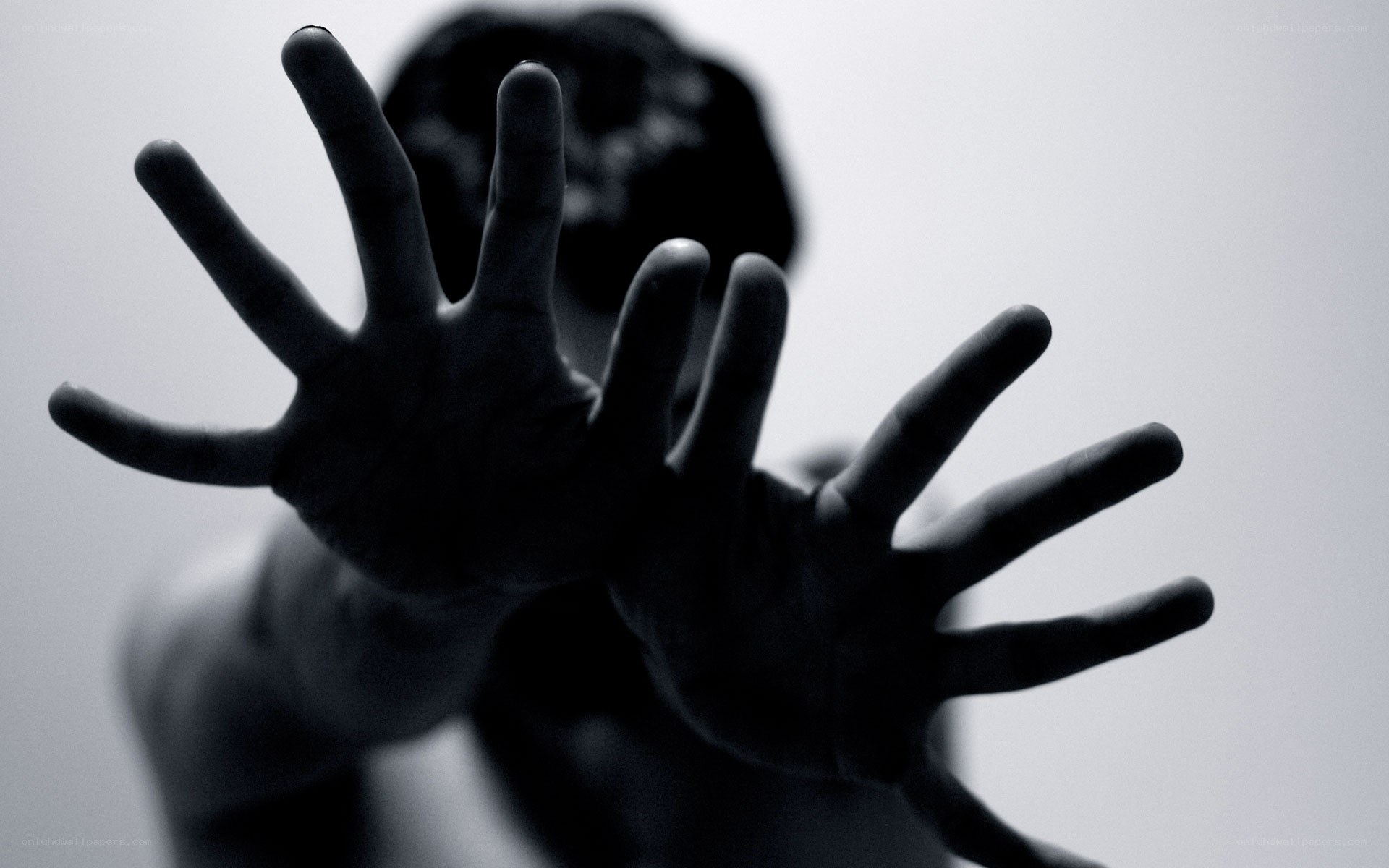 hands reaching forward