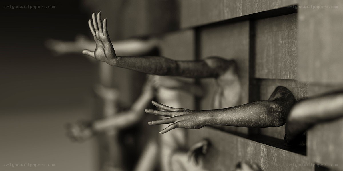 Hands reaching from a wall