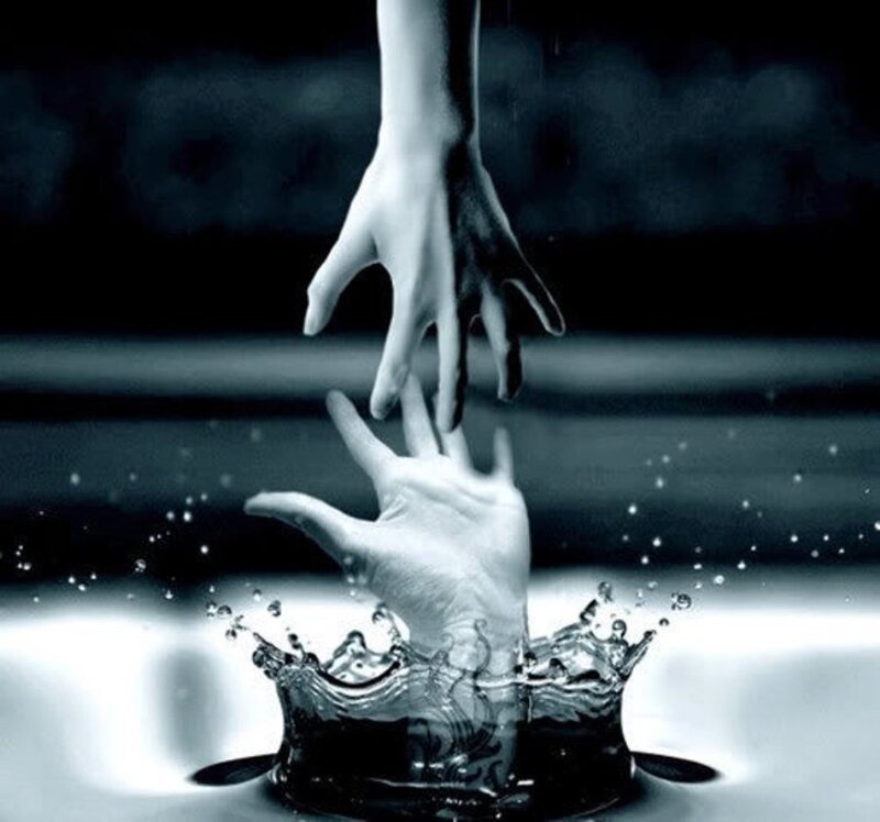 hands reaching through water