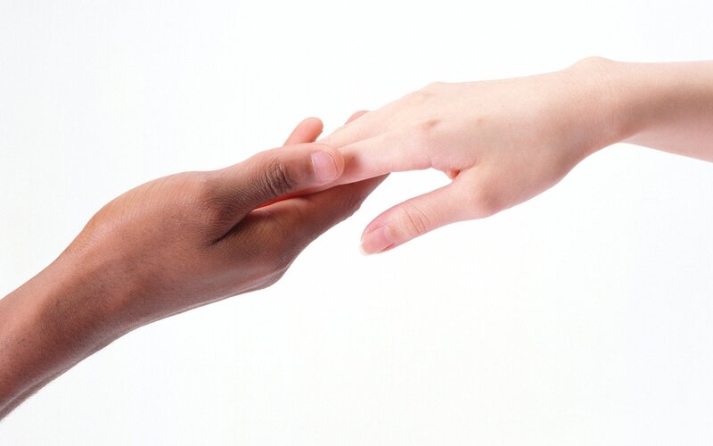 hands reaching to connect