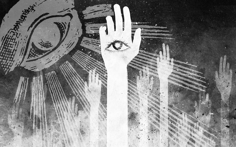 Hands reaching toward an eye