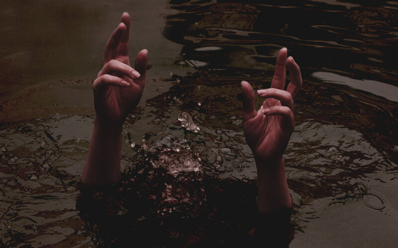 Hands Rising from Water — Brown