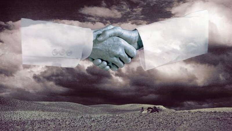 hands shaking in stormy sky