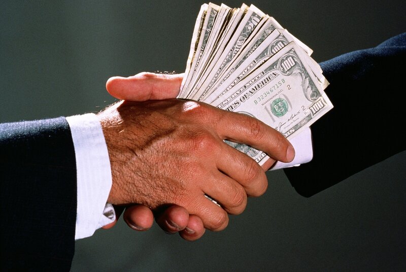 Hands Shaking with Money