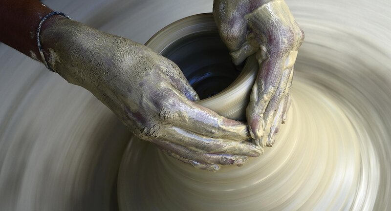 Hands Shaping Clay Pot