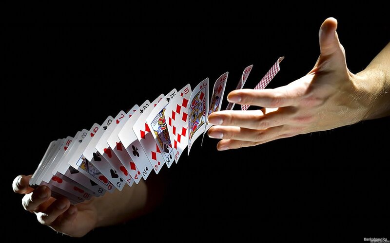 hands shuffling playing cards