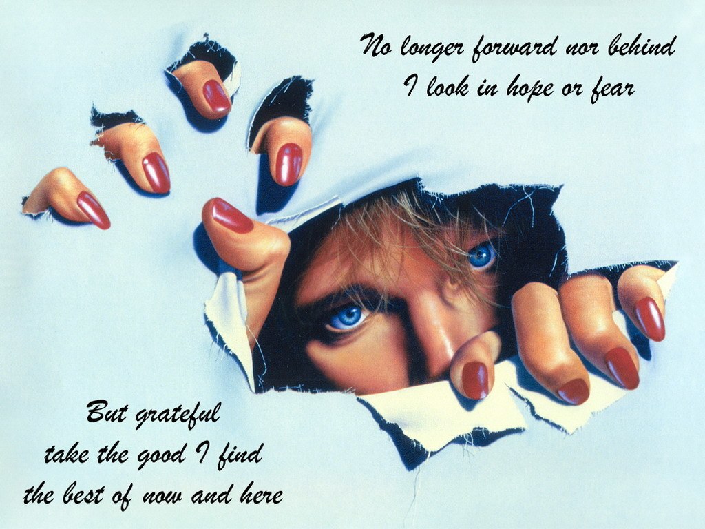 hands tearing paper with eyes