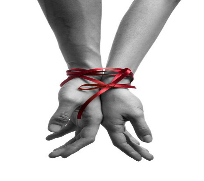 Hands Tied with Red Ribbon