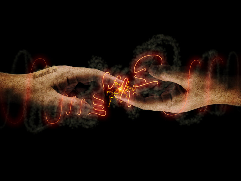 hands touching with energy