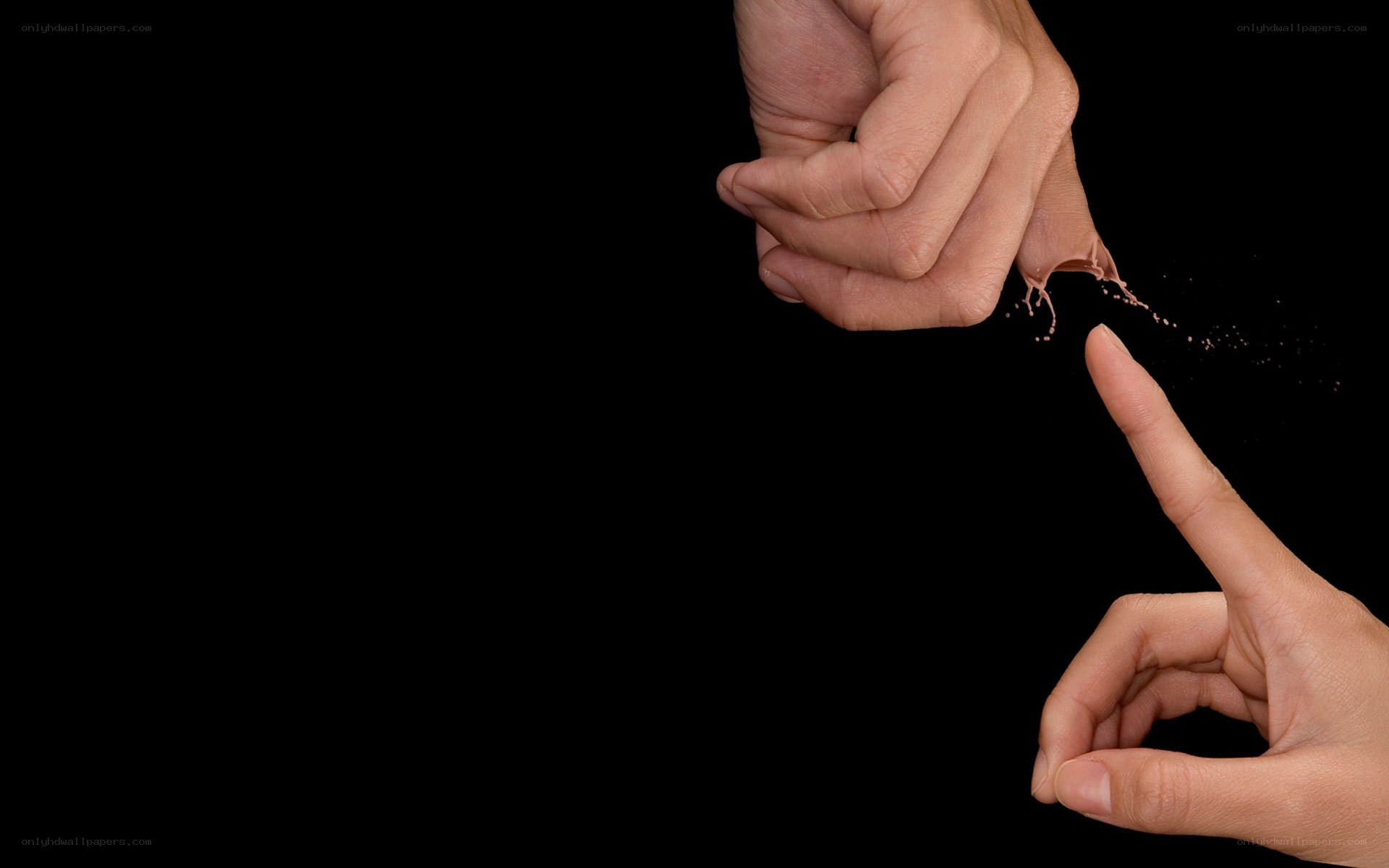 hands touching with liquid splash