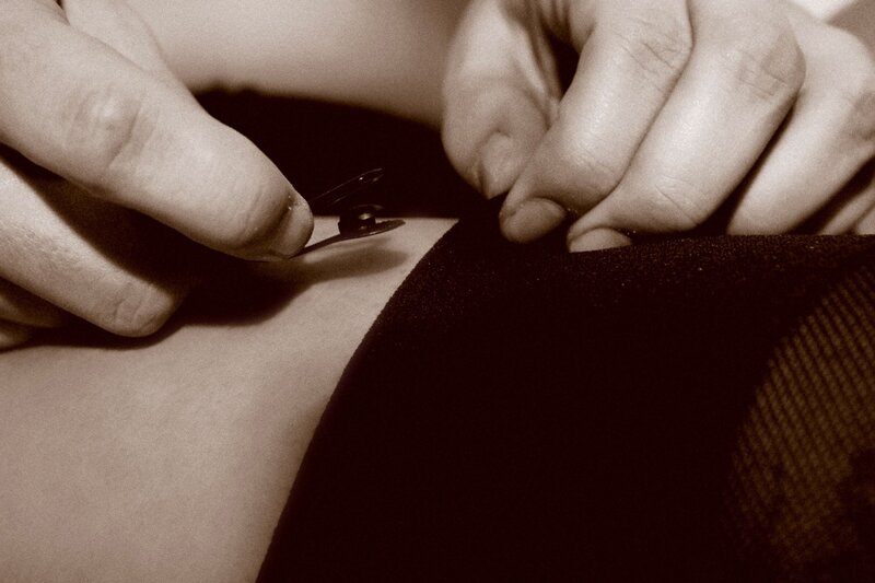 hands using scissors on fabric
