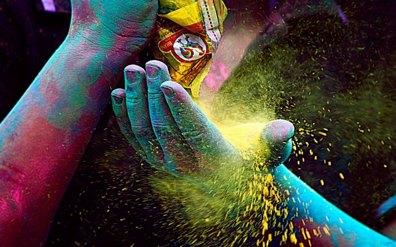 hands with colored powder