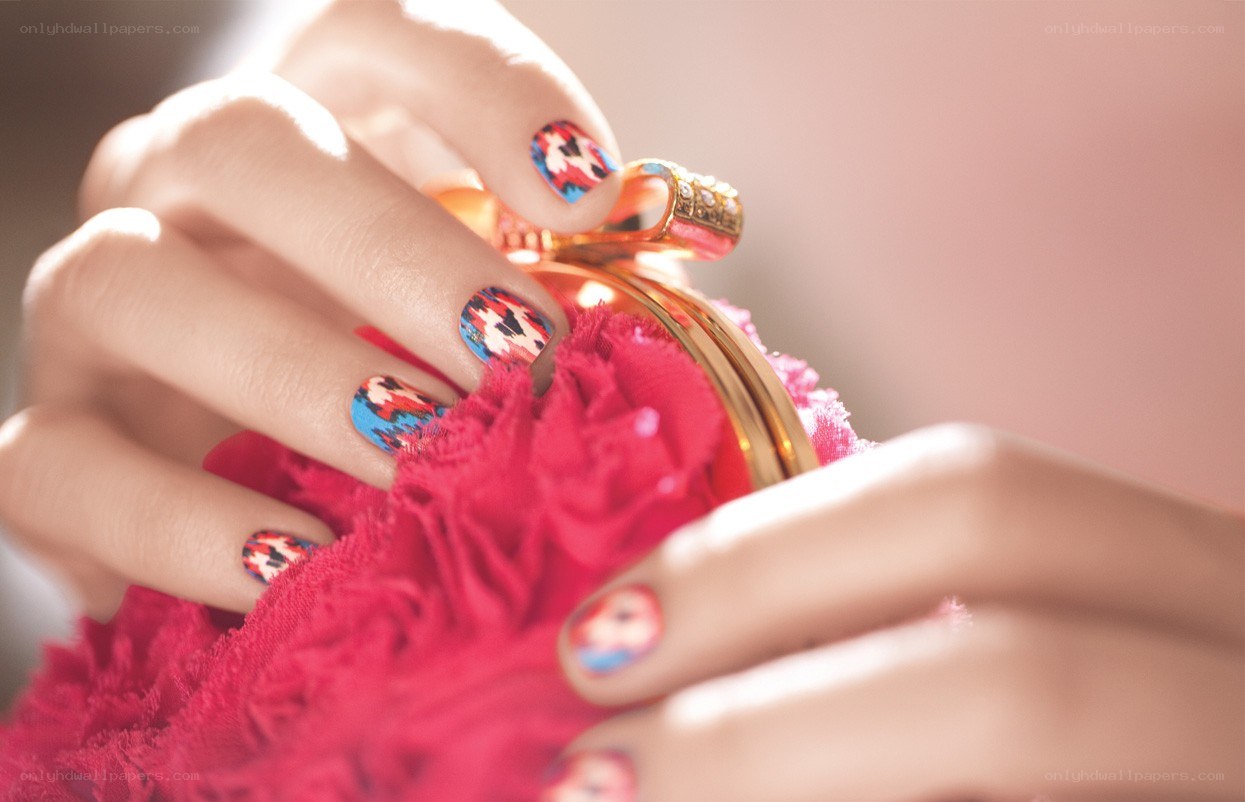 hands with colorful nail art
