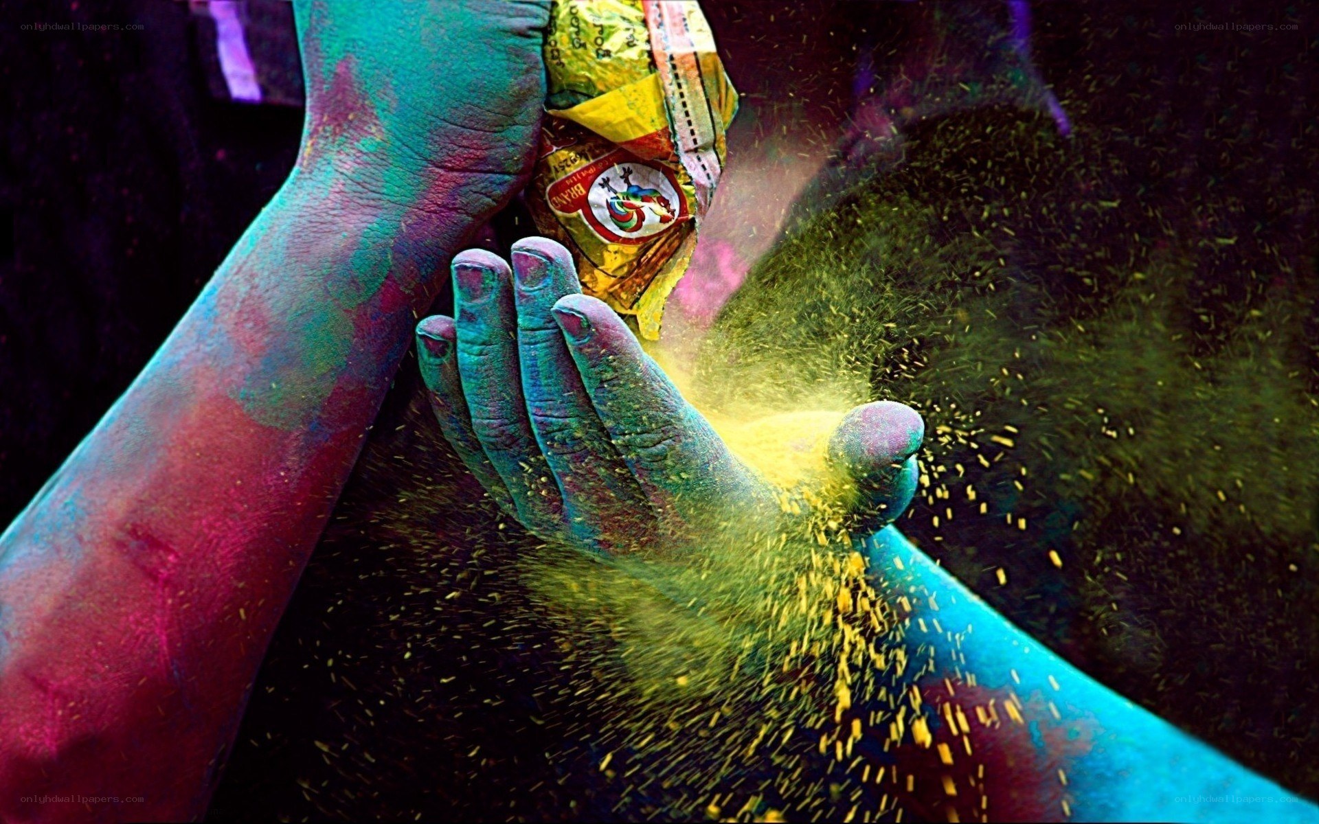 hands with colorful powder
