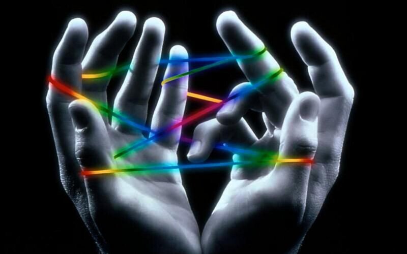 Hands with colorful strings