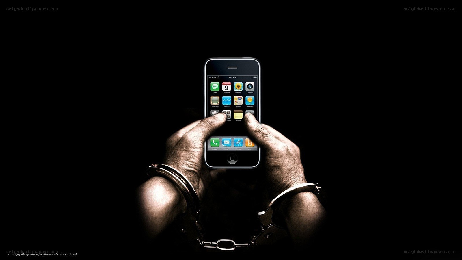 Hands with handcuffs holding phone