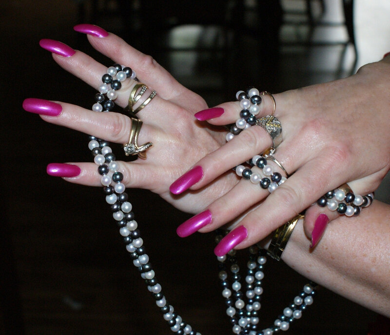 hands with jewelry and nail polish