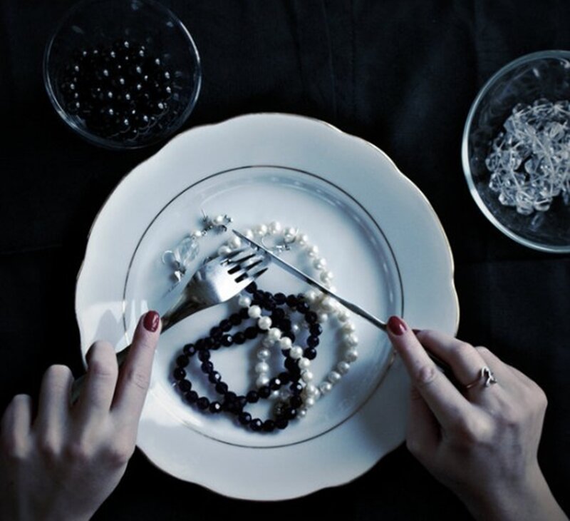 Hands with Jewelry on Plate