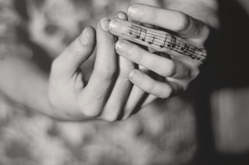 Hands with Music Tattoo