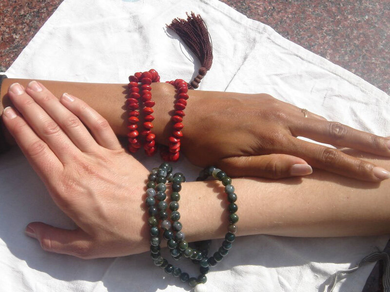 hands with prayer beads