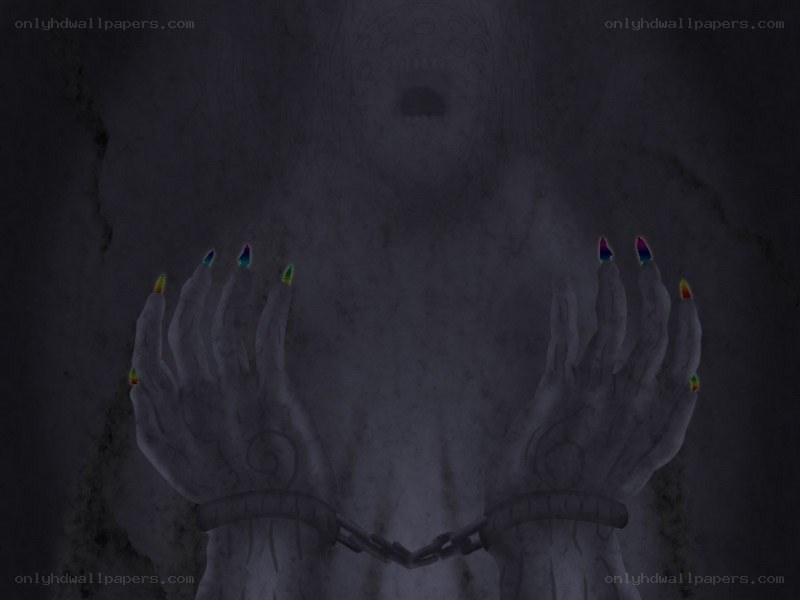 hands with rainbow nails in dark room