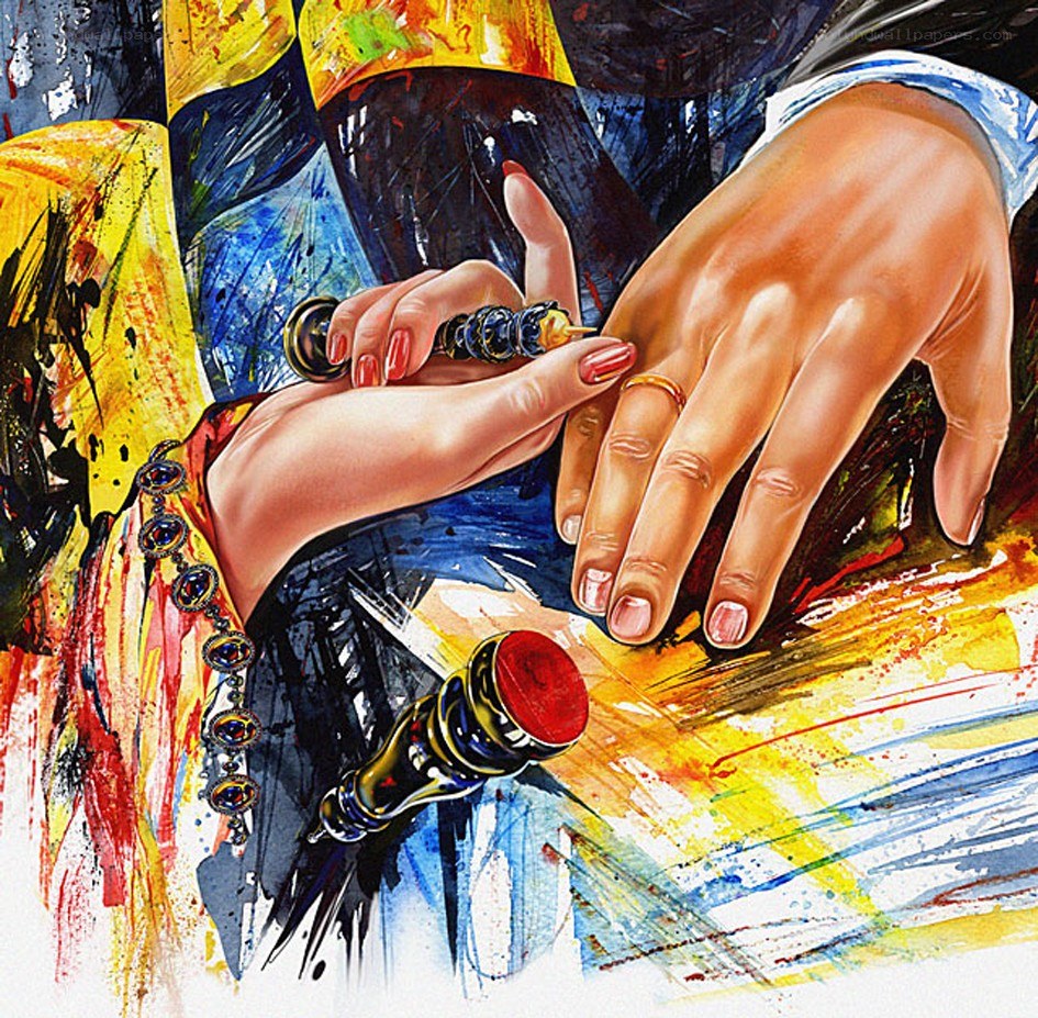 hands with rings and paint
