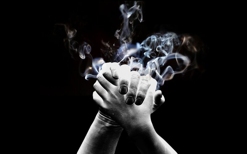 hands with smoke