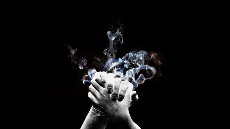 hands with smoke