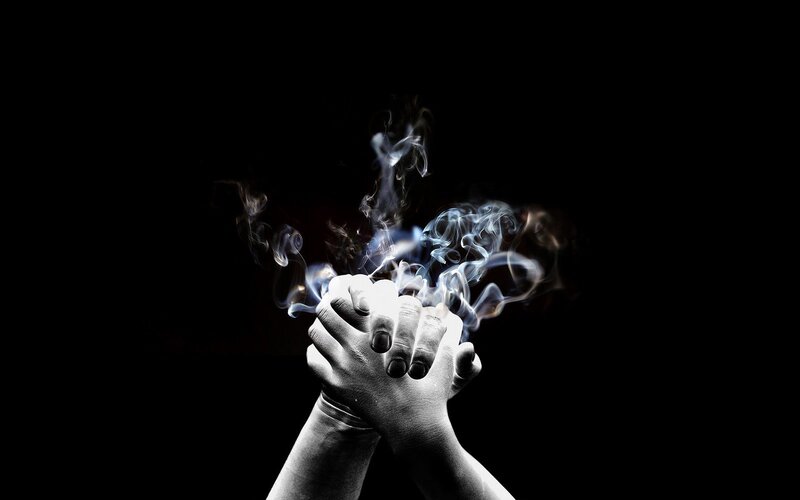 hands with smoke